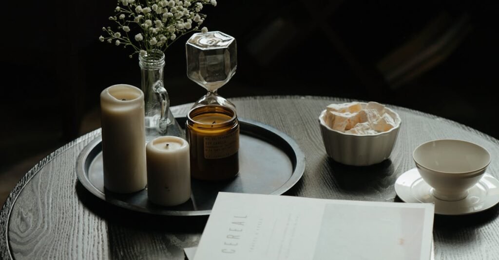 A cozy coffee table setting with books, candles, and a cup of tea - perfect for a relaxing break.